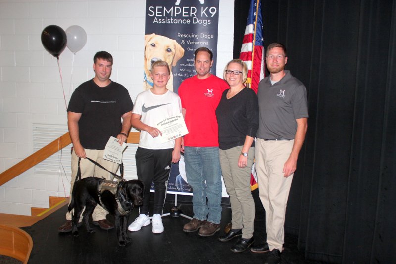 Semper K9's Vinny, his handler, K9 Coach Family and our Executive Director Christopher Baity.
